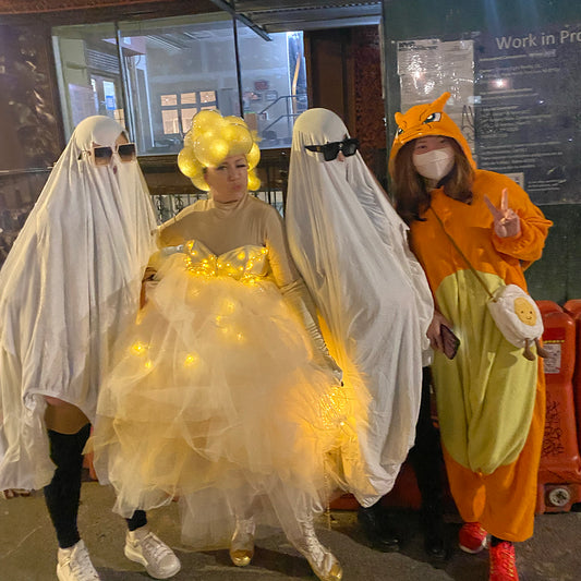 Photo by Laura Favorito. A moment from Halloween in NYC where Stacey, dressed as Queen Bubble, poses with ghosts.
