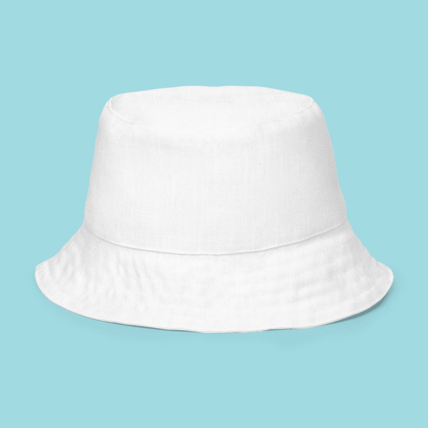 a series of 5 reversible bucket hats lined up.
