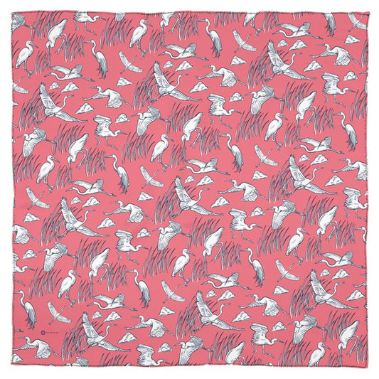 This lovely square, Georgette silk scarf is decorated with illustrations inspired by the Great Egret. Its dazzling white feathers pop against linear drawings of grassy wetlands on a pink blush background scattered with clouds. This scarf honors these wild and beautiful creatures and the ecosystems they live in.